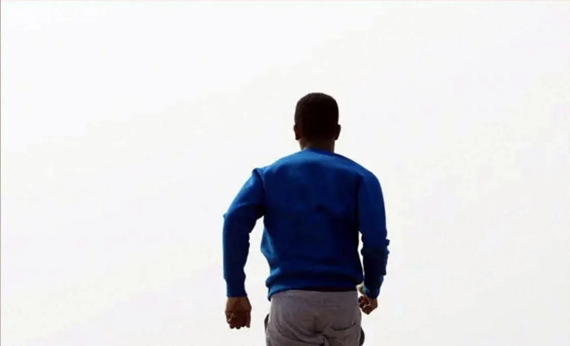 Person walking outdoors after recovery from a joint injection
